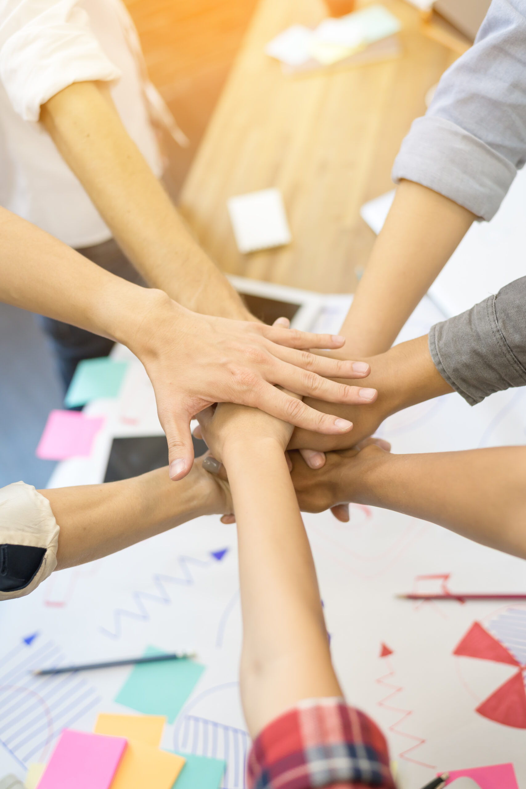 close-up-hand-s-asian-group-professional-colleagues-join-hands-together-our-purpose