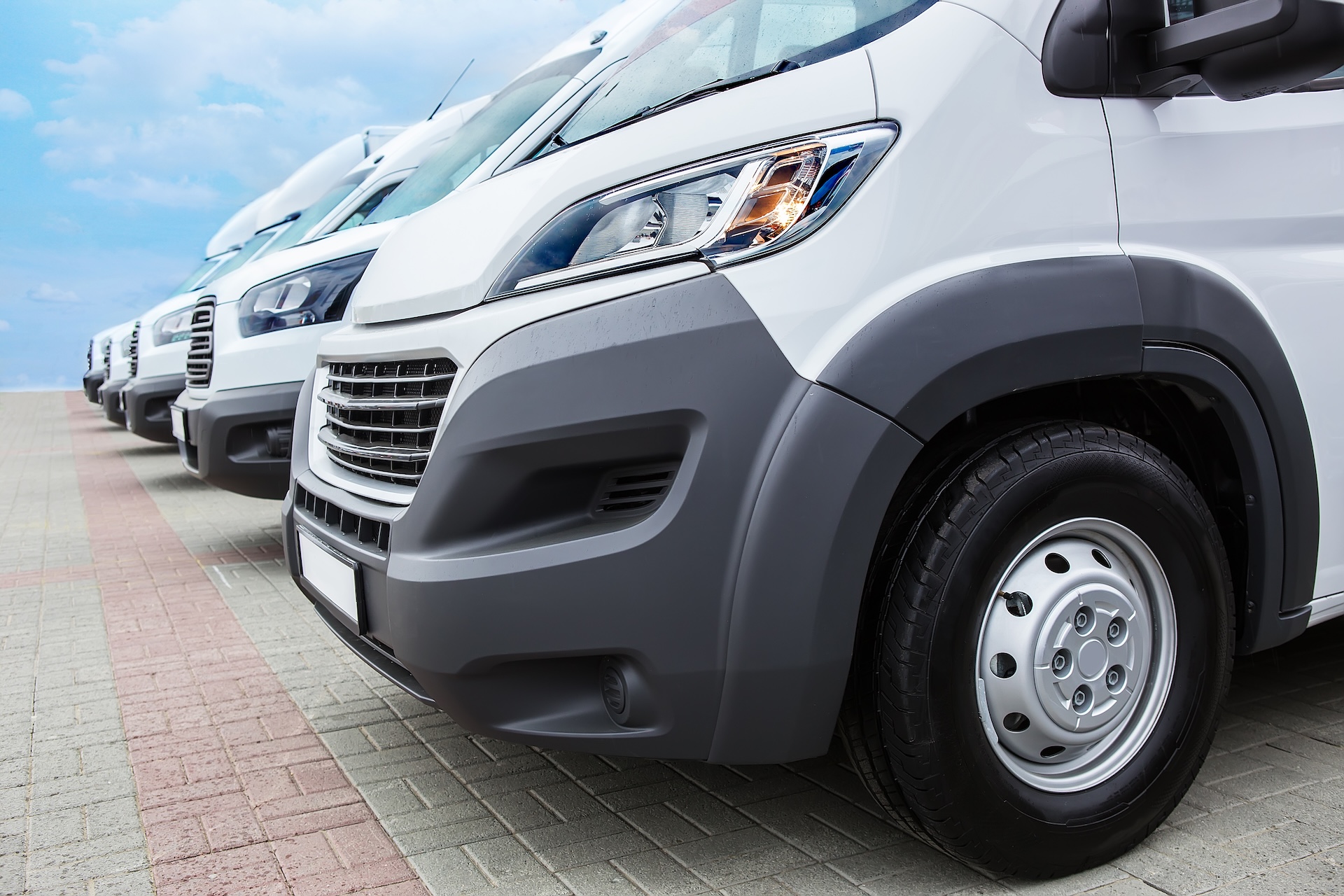 Number,Of,New,White,Minibuses,And,Vans,Outside